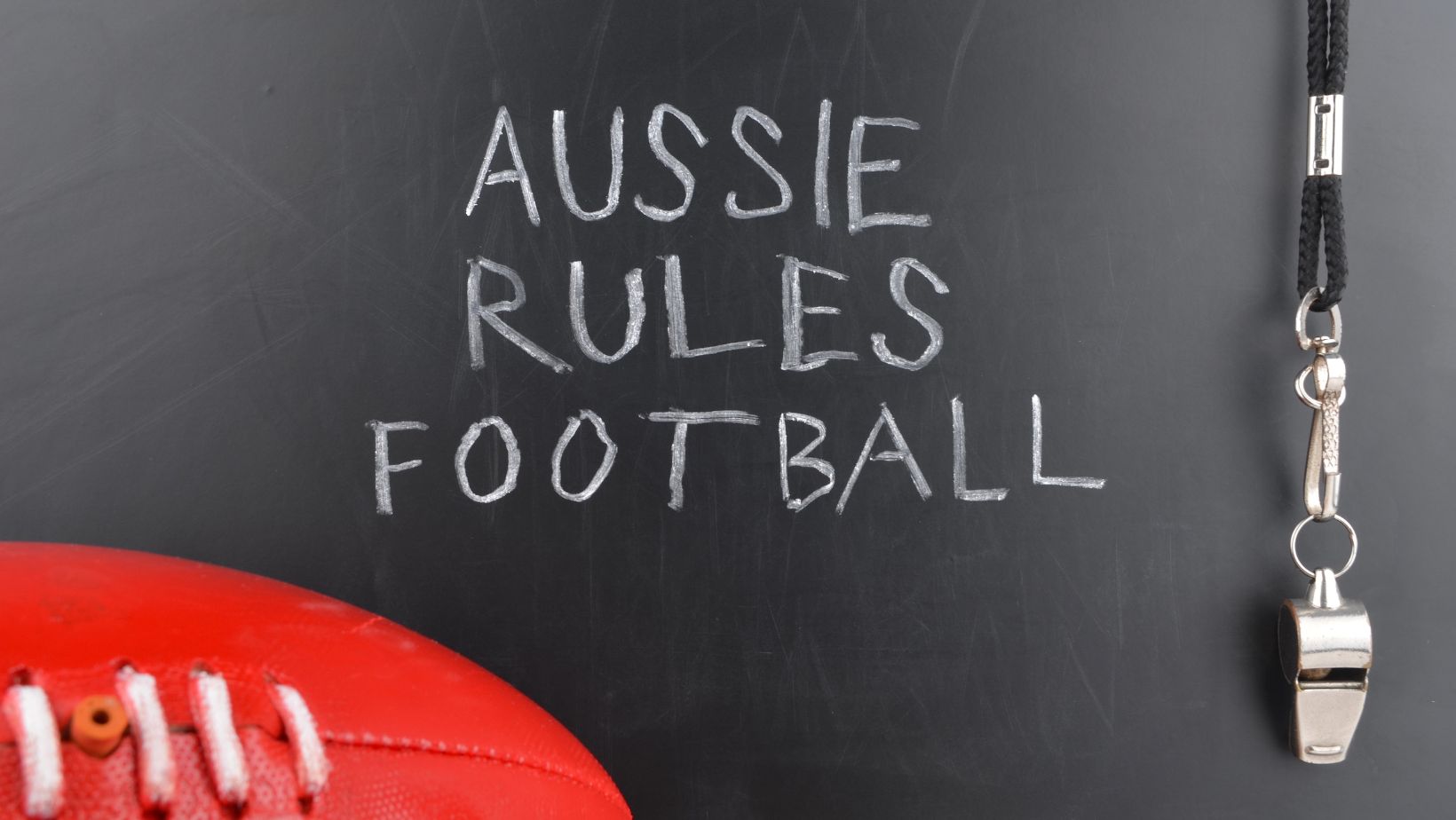 Aussie Football with a whistle and it saying Aussie Rules Football