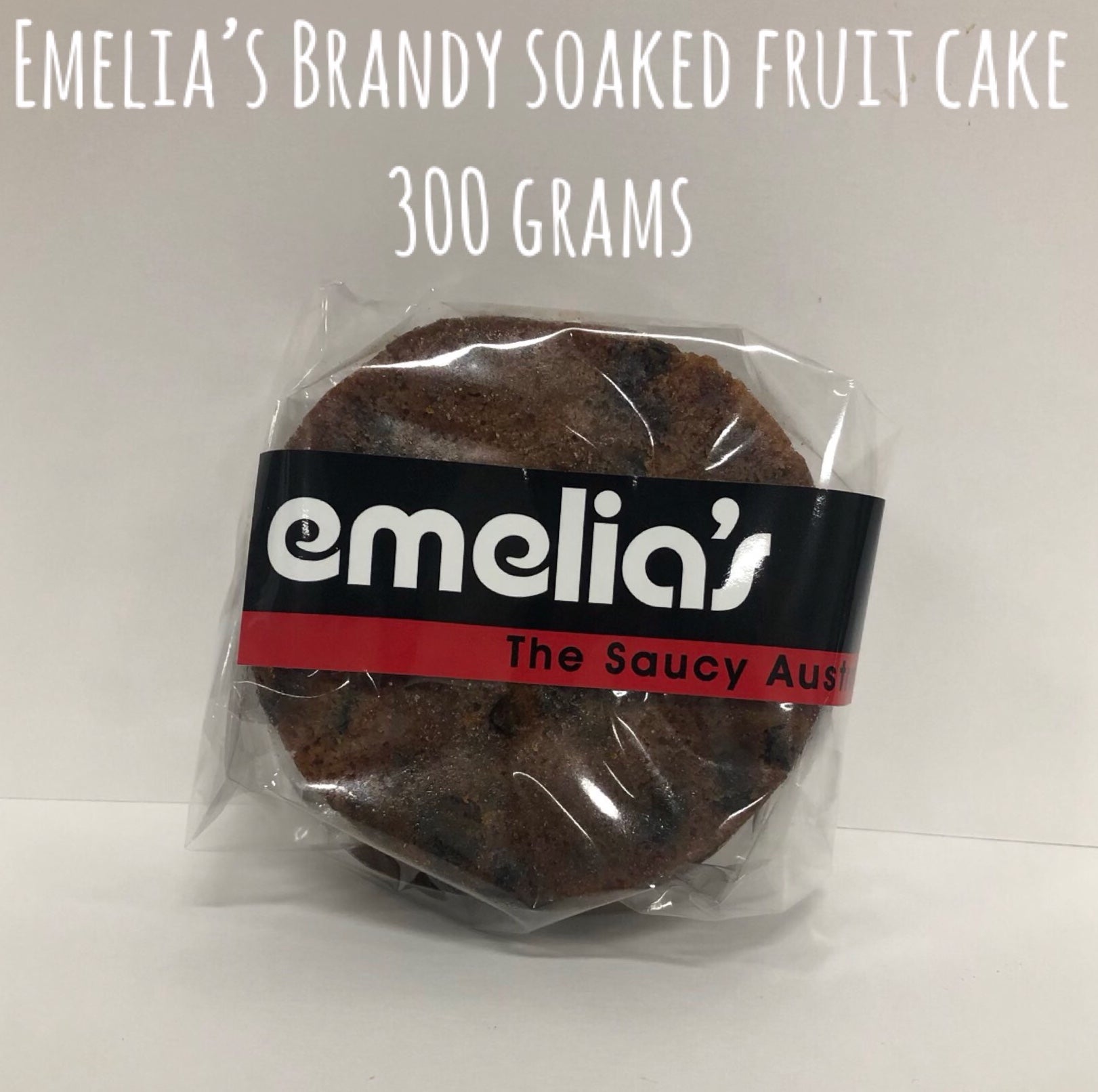 Emelia’s The Saucy Australian 300g traditional fruit cake, rich with soaked fruits and served with warm custard.