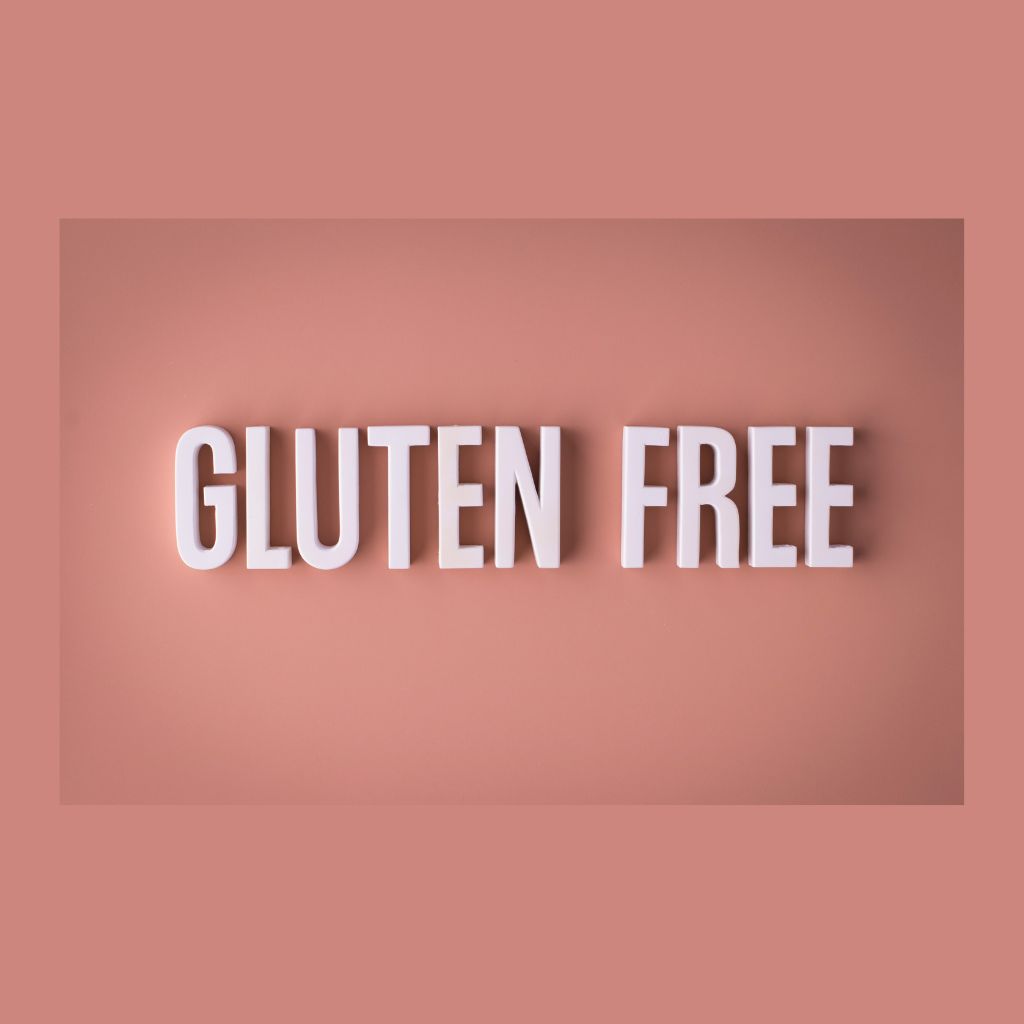 Gluten Free flours on spoons spelling out gluten free