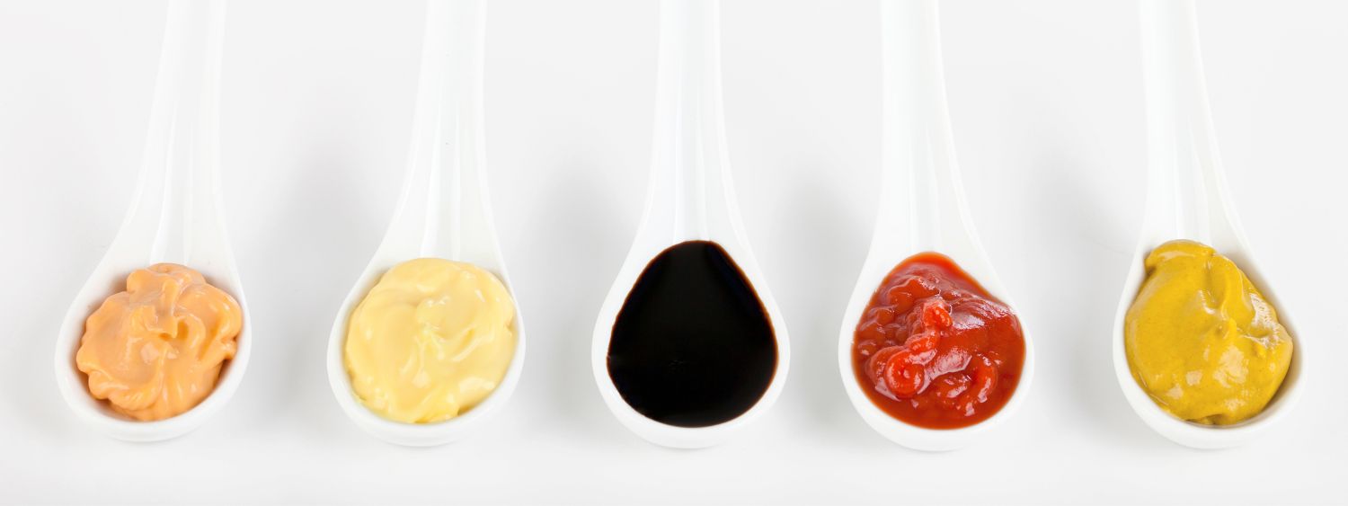 Different Emelia Sauces in soup spoons 